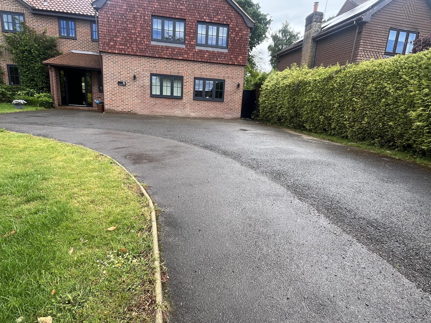 Tarmac driveway before tar and chip transformation