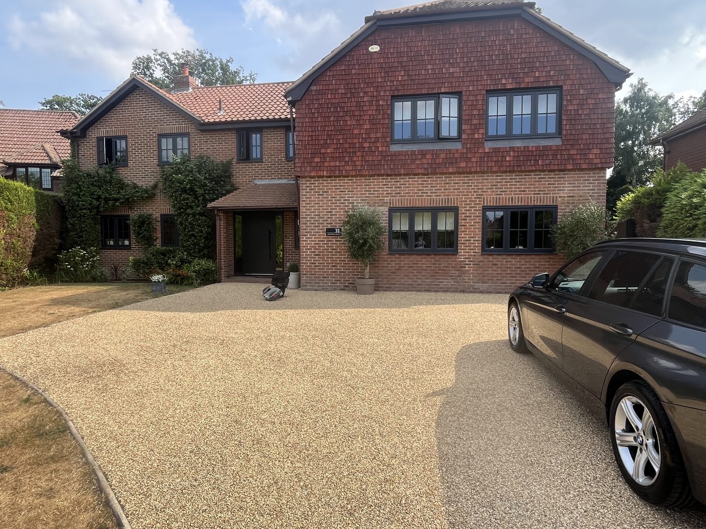 Fresh golden tar and chip driveway after resurfacing